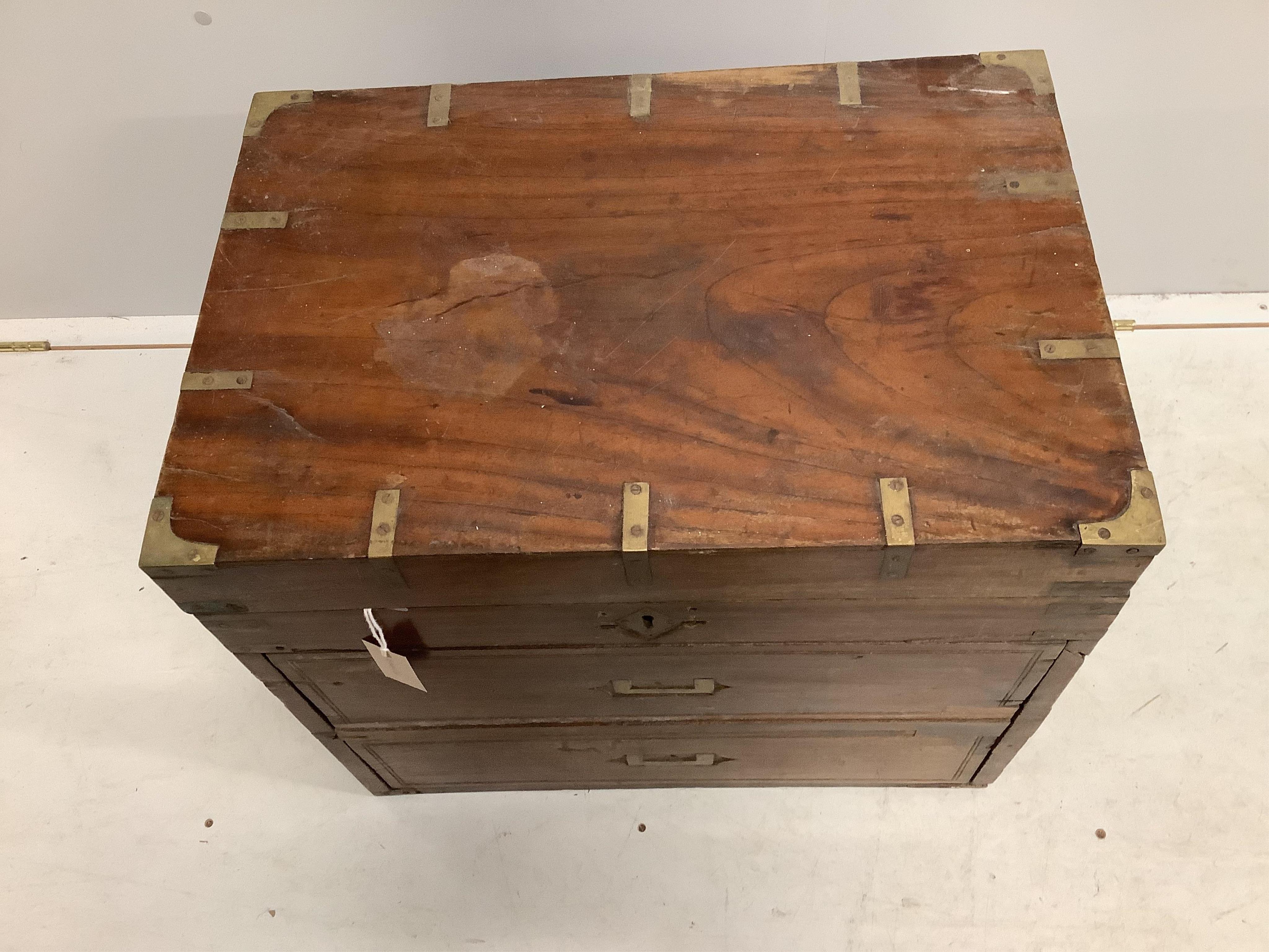 A 19th century brass mounted teak trunk with dummy drawer front, width 60cm, depth 41cm, height 54cm. Condition - fair